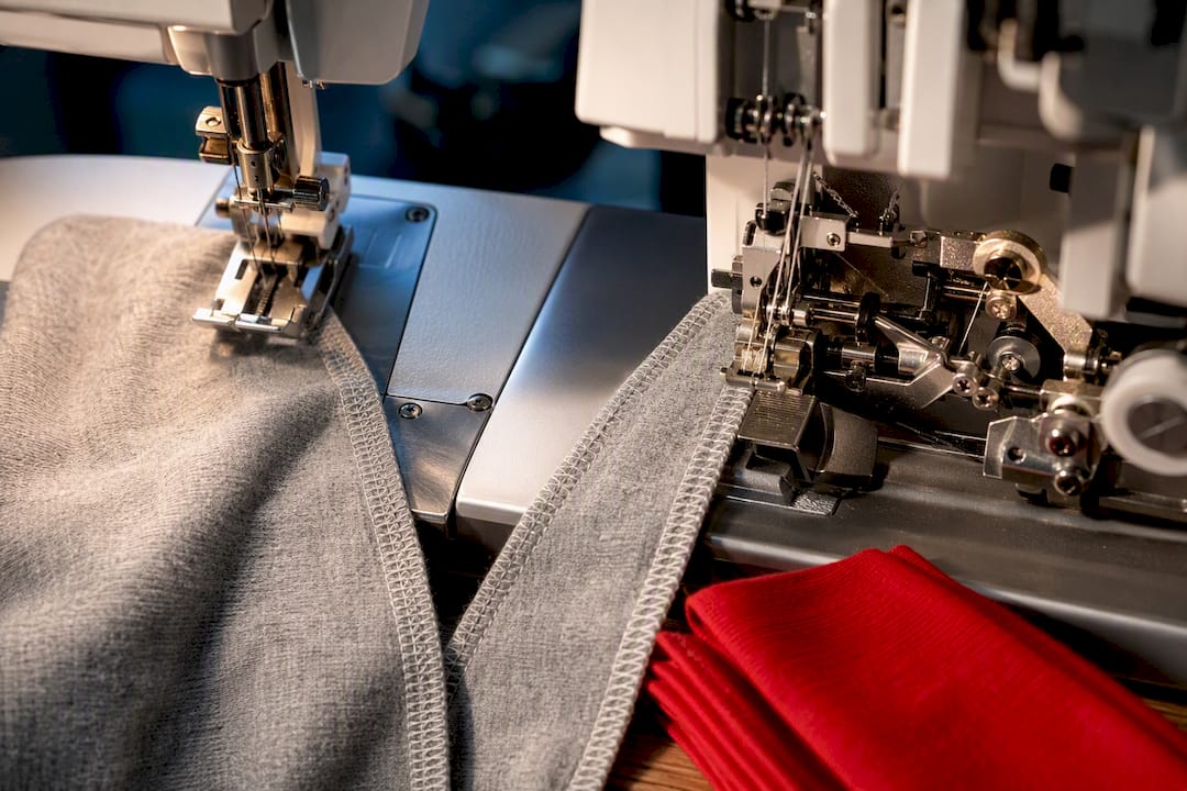 Partial serger and coverstitch mechanisms