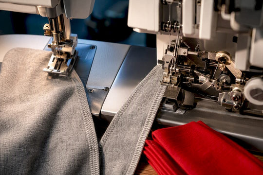 Partial serger and coverstitch mechanisms