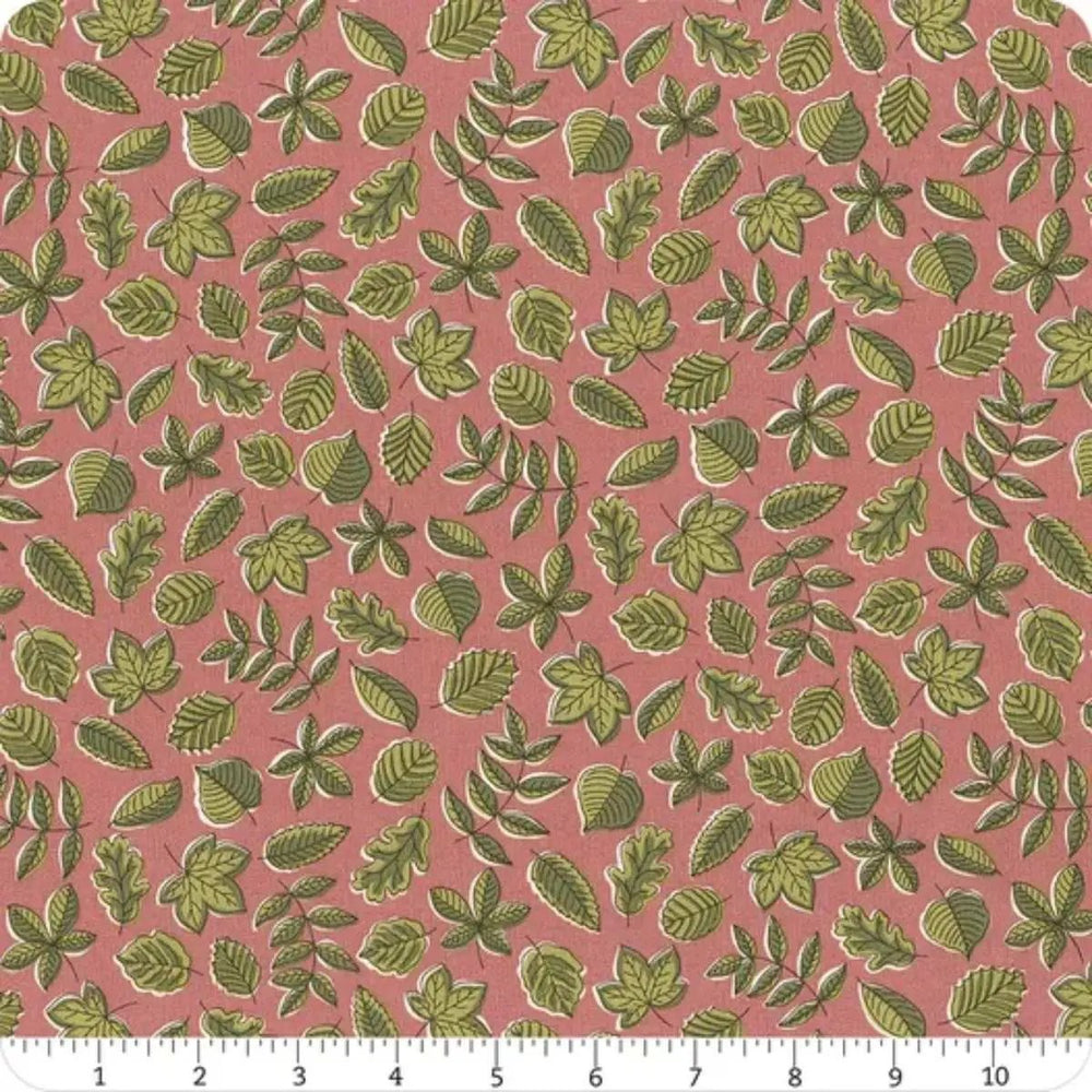 Autumn Woodland Leaf Flutter A quilting cotton fabric with scattered green woodland leaves on a soft pink background.