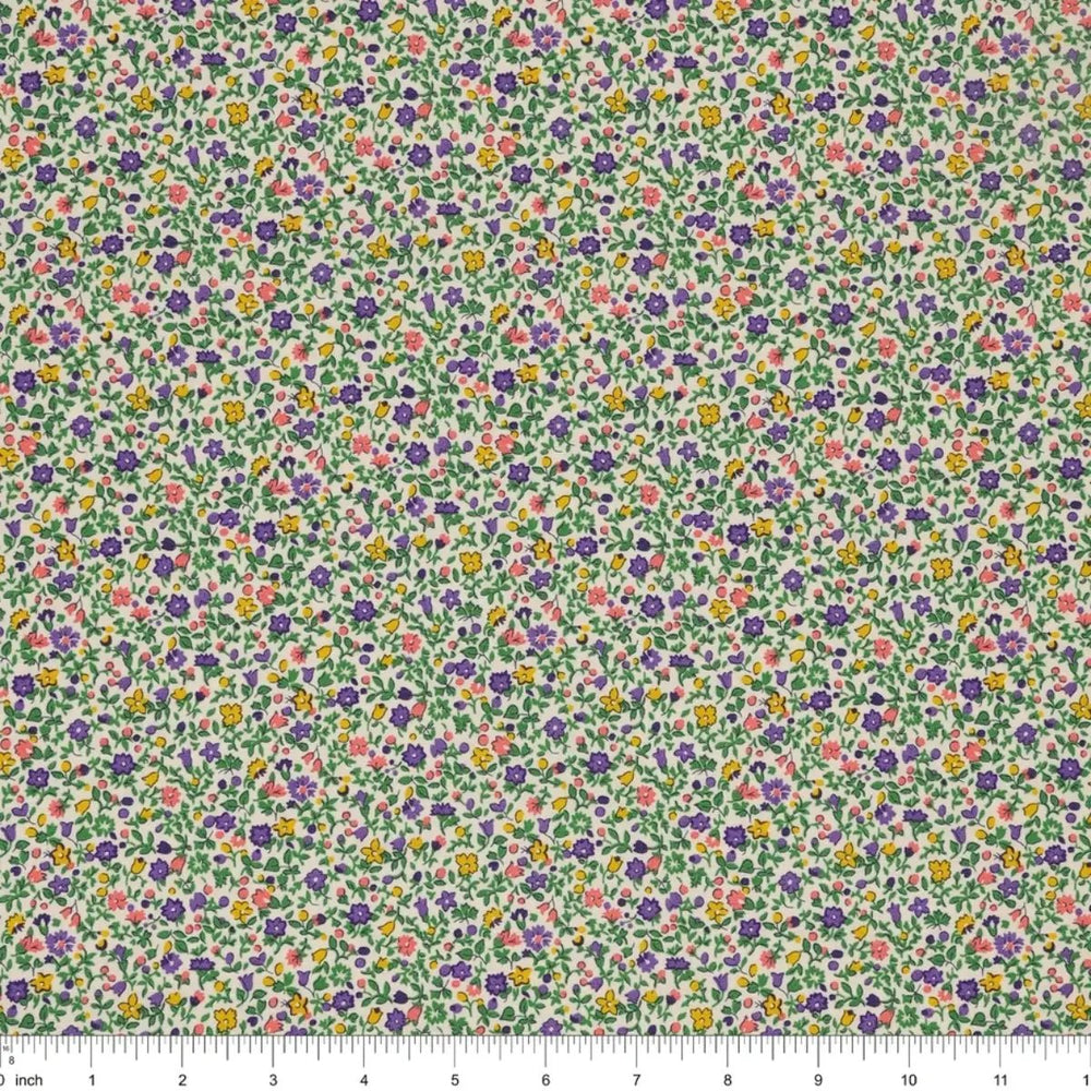Everlasting Posy Haze A quilting cotton fabric with tiny purple, yellow, pink, and green floral motifs on a light background.