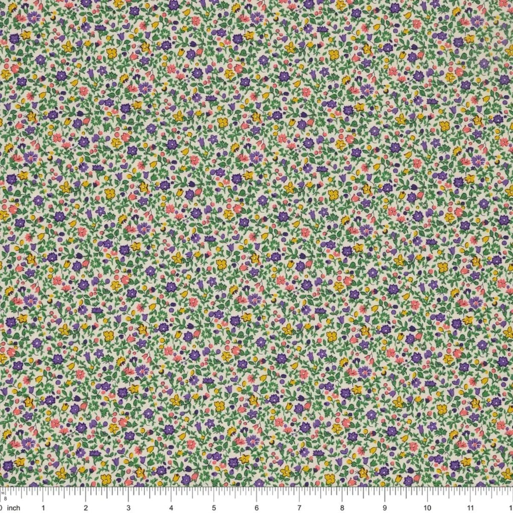 Everlasting Posy Haze A quilting cotton fabric with tiny purple, yellow, pink, and green floral motifs on a light background.