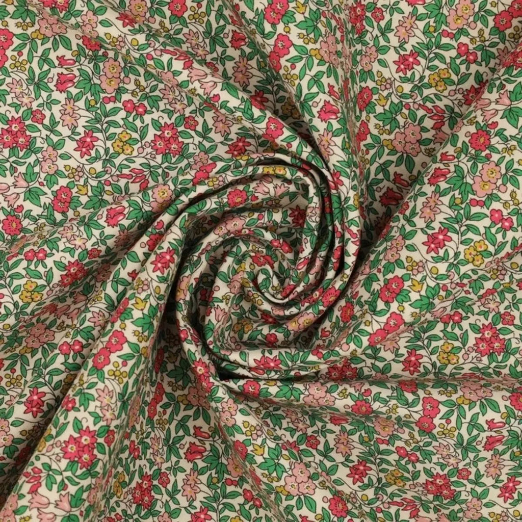 Everlasting Forget Me Not Blossom B quilting cotton fabric with pink flowers, teal leaves, coral accents, and delicate botanical stems.