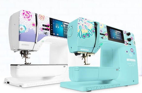 Two Bernina sewing machines with floral designs on a white background