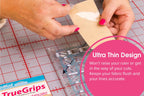 Grace TrueCut True Grips quilting grips on beige sheet with circular adhesive rings