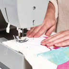 Warm & Natural Cotton Batting Twin 72x90 precut; white batting being sewn under a presser foot