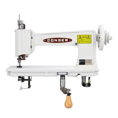Consew 104-1T industrial sewing machine with assembled table and servo motor, white.