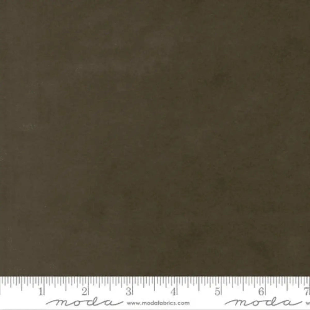 Flannel Gatherings Basics Forest Muslin cotton flannel fabric with a deep forest green mottled tonal texture.