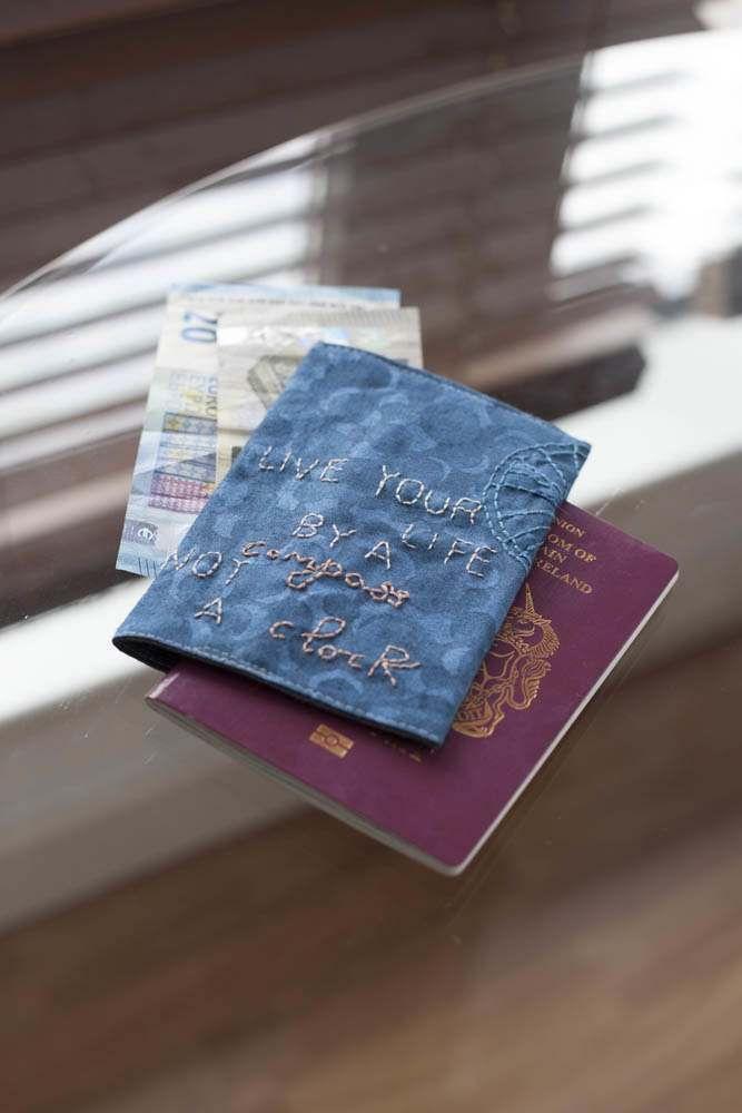 Threaders Embroidery Transfer Sheets Traveller: blue embroidered passport cover atop a purple passport