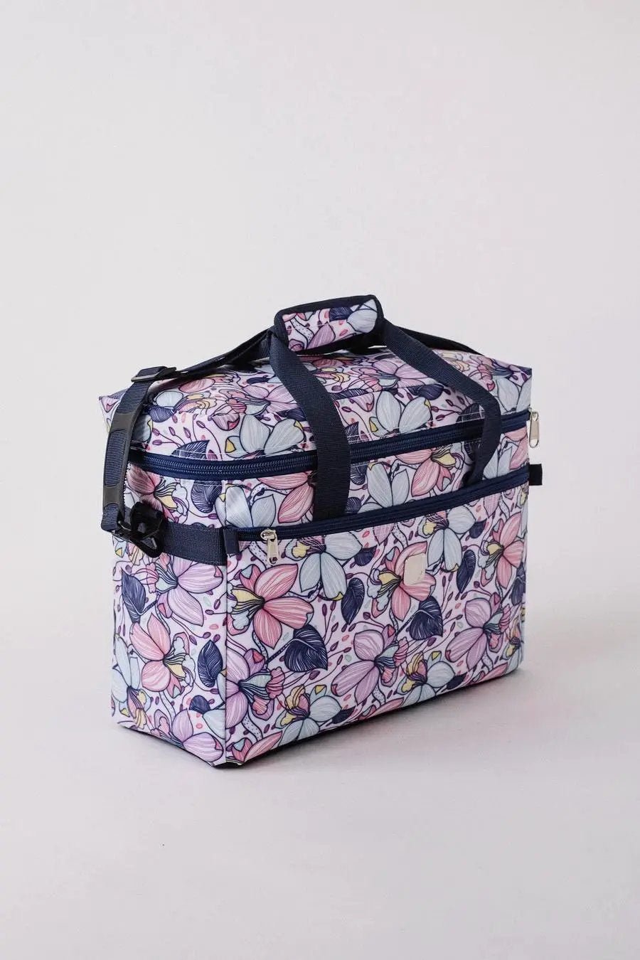 Bluefig Quilter Essential Maisy floral bag with navy handles and zip pockets
