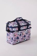 Bluefig Quilter Essential Maisy floral bag with navy handles and zip pockets