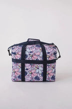 Bluefig Quilter Essential 19in wheeled bag in floral print with navy straps.