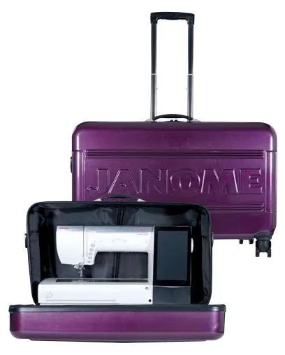 2-item Janome machine bags; purple hard rolling cart and Memory Craft 15000 sewing machine in black bag.
