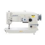 Consew 199R cream-colored single-needle drop-feed industrial sewing machine with table and motor