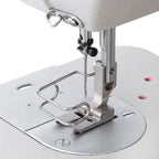 Consew 199RB single-needle industrial sewing machine with table and motor, drop-feed, presser foot close-up