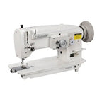 Consew 199RB single-needle drop-feed industrial sewing machine with table and motor, white.