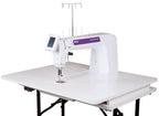 Pfaff PowerQuilter 16.0 long-arm quilting machine in white with purple branding on a quilting table