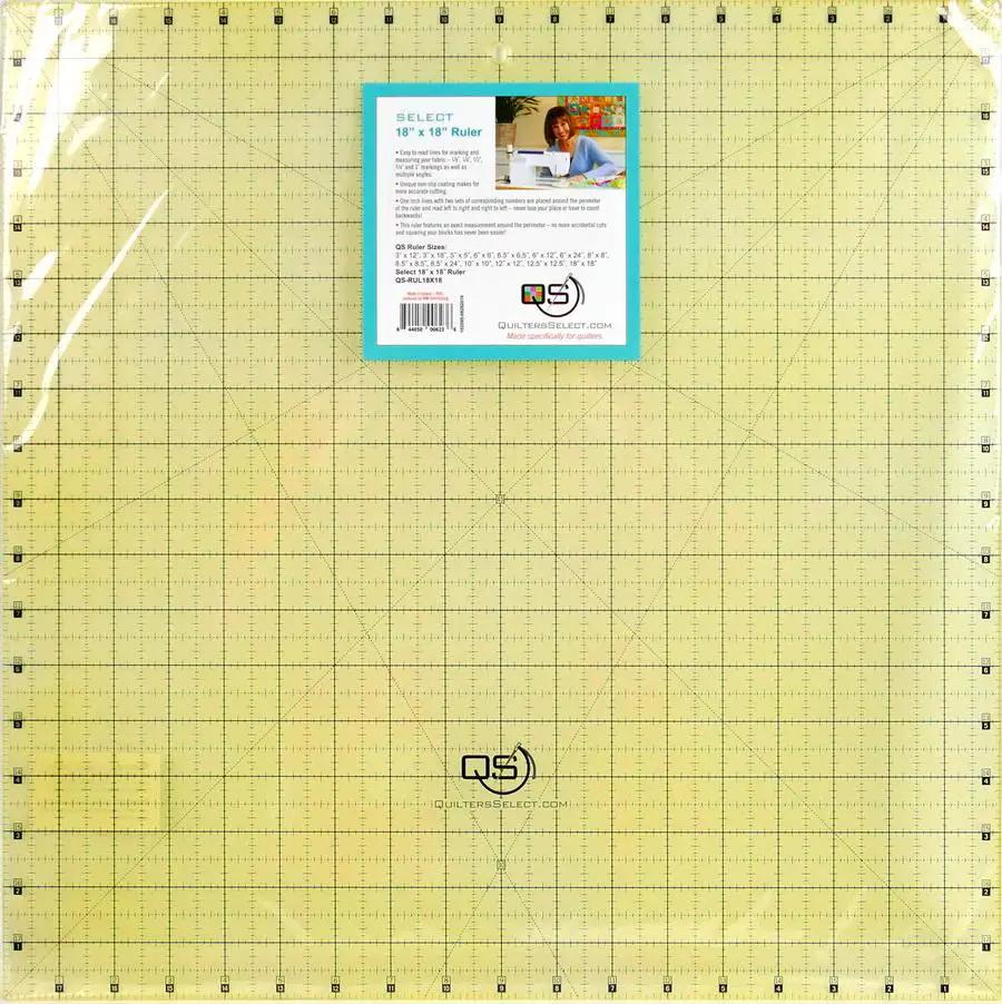 Quilters Select 18x18 non-slip ruler on a yellow quilting grid mat