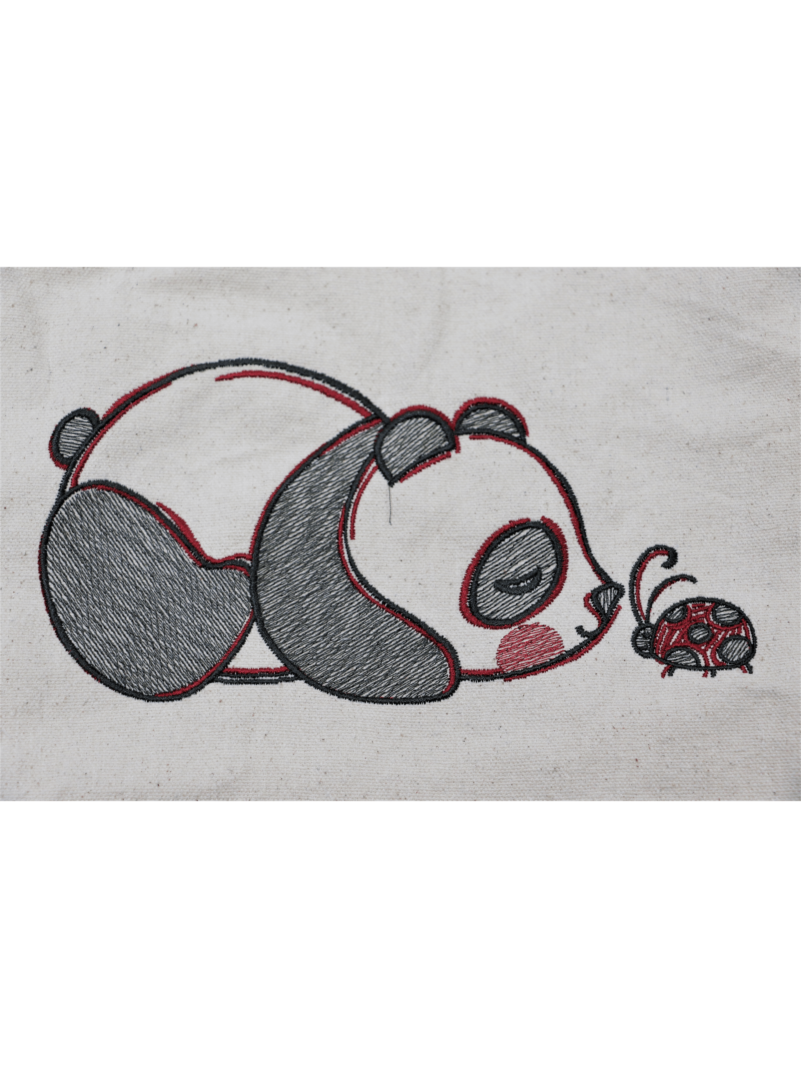 Design of a teddy bear on a white cloth