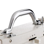 Industrial sewing machine top handle close-up; chrome metal handle on white body.