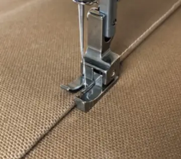 Janome Bi-Level Foot Right (High Speed) sewing machine foot on brown fabric