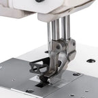 Consew 2040 industrial sewing machine needle area with walking foot on metal table