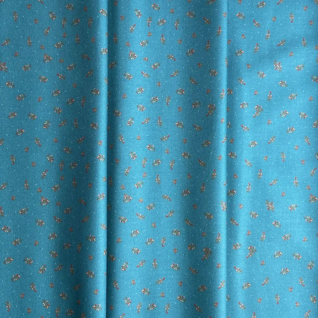 The Magical Garden Little Rose Ocean Blue quilting fabric with red and cream rosebuds and green leaves by Sarah J Patterson