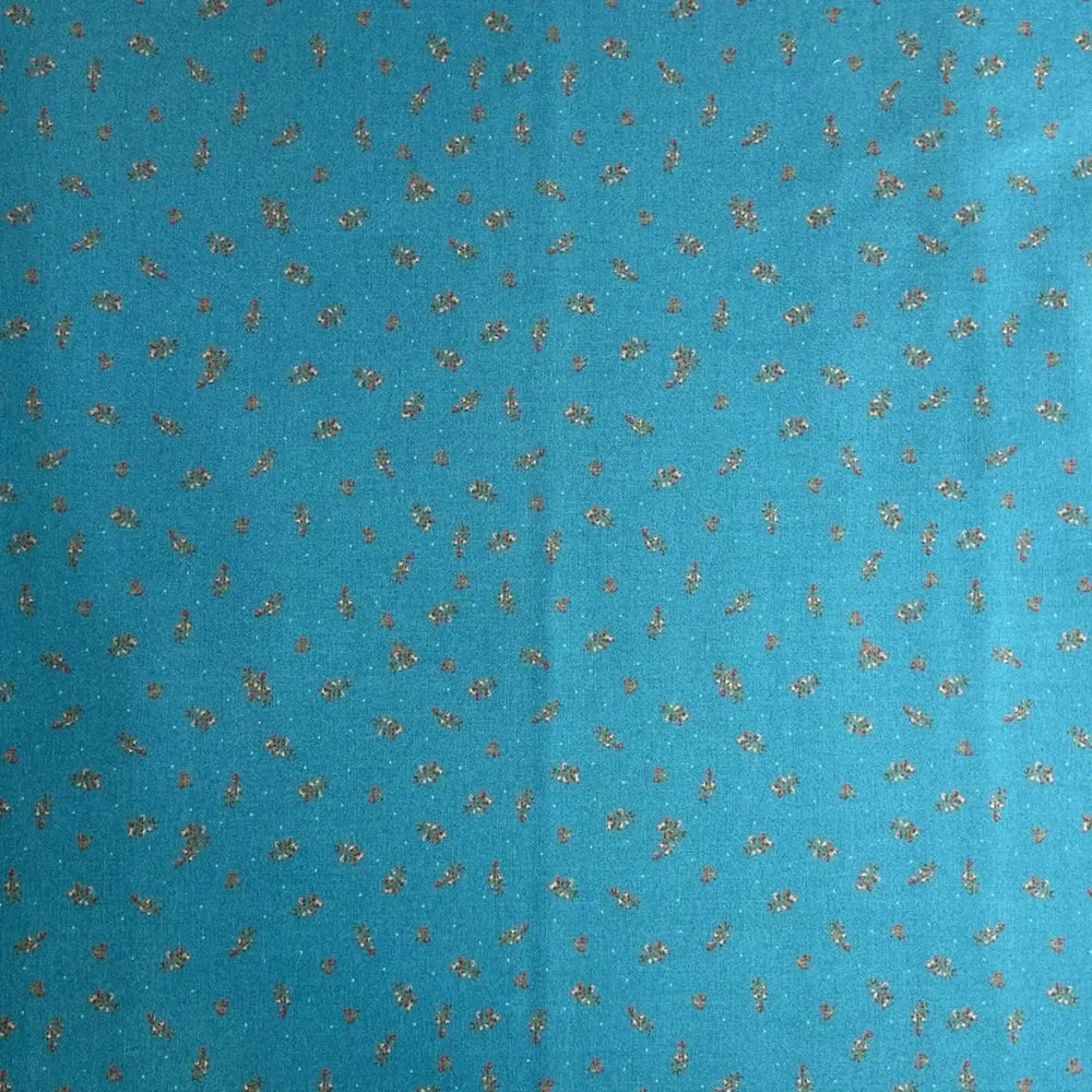 The Magical Garden Little Rose Ocean Blue quilting fabric with red and cream rosebuds and green leaves by Sarah J Patterson