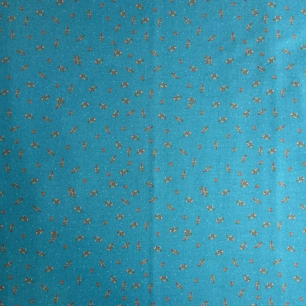 The Magical Garden Little Rose Ocean Blue quilting fabric with red and cream rosebuds and green leaves by Sarah J Patterson