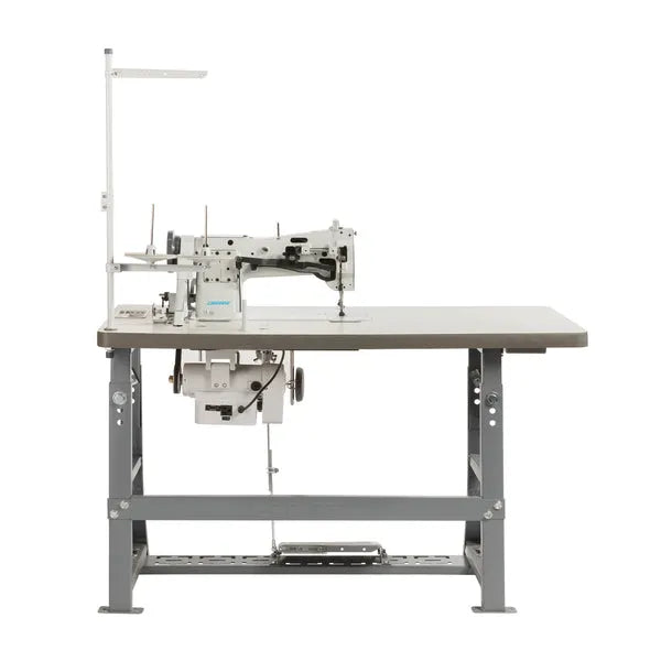 Consew 206RB-5 walking-foot upholstery sewing machine on table with stand and 110V servo motor