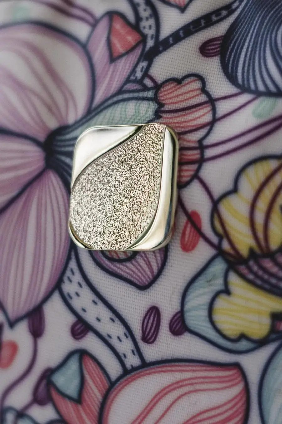 Bluefig Quilter Essential silver metal hardware piece on floral background