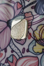 Bluefig Quilter Essential silver metal hardware piece on floral background