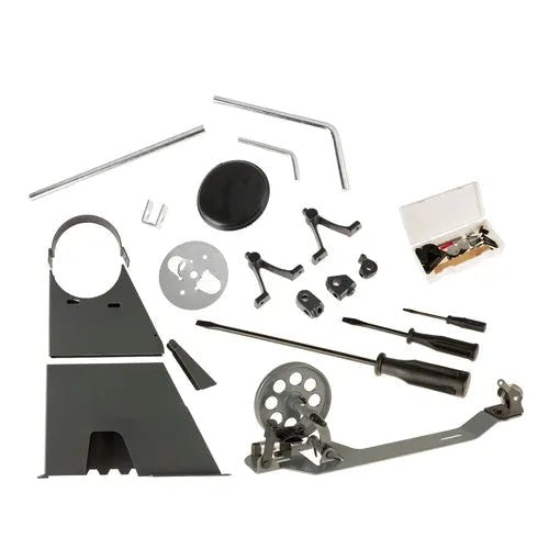 Consew 228R-11-1 sewing machine parts kit with assembled table; assortment of metal gears, levers, screws, and tools