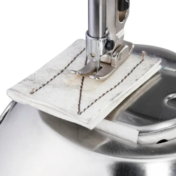 Consew 228R-WIG high-speed post-type sewing machine presser foot on white fabric with brown stitching