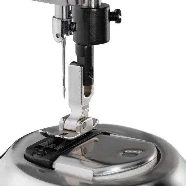 Consew 228R-WIG industrial sewing machine needle area with metal presser foot