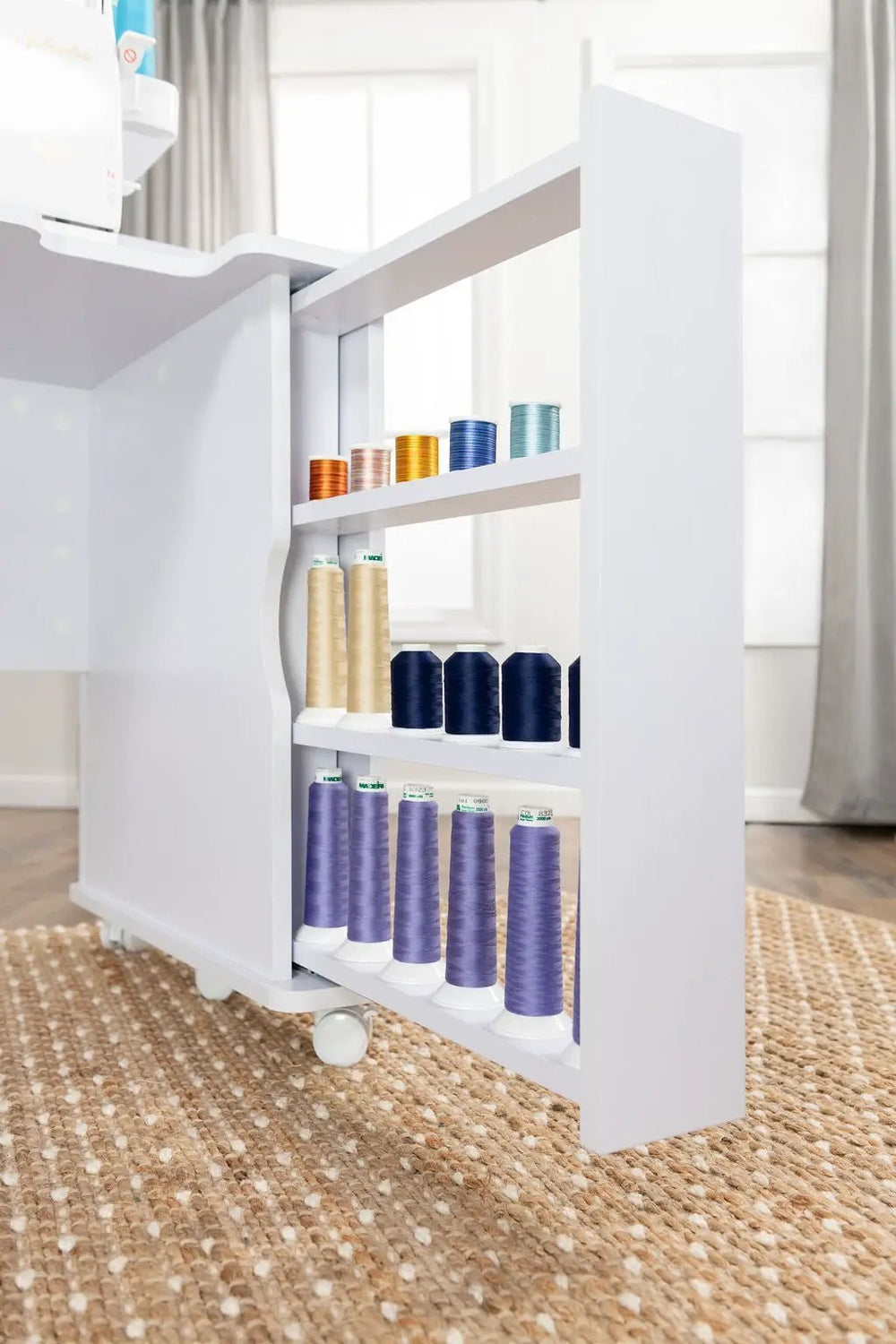 New Koala Serger Studio sewing machine extension table with white frame and several colorful thread spools
