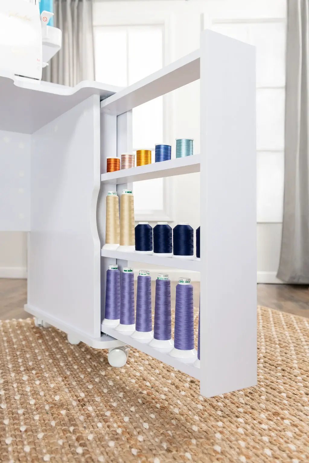 New Koala Serger Studio sewing machine extension table with white frame and several colorful thread spools