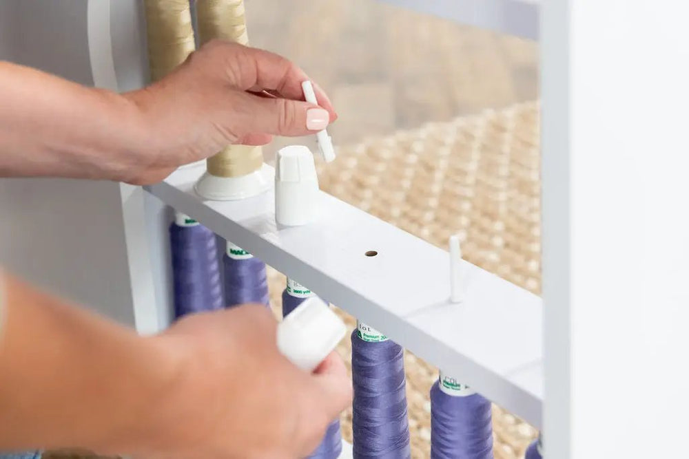 Koala Serger Studio white sewing machine extension table with purple thread spools