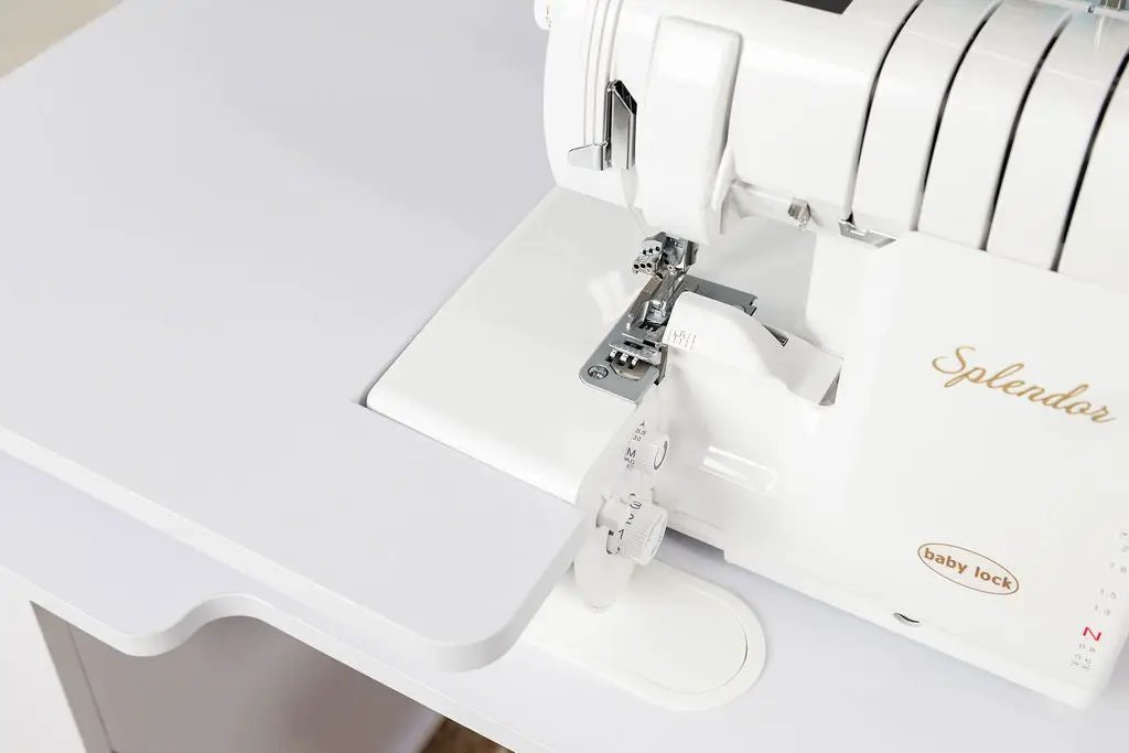 Koala Serger Studio extension table with white surface and Baby Lock Splendor serger on top