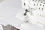 Koala Serger Studio extension table with white surface and Baby Lock Splendor serger on top