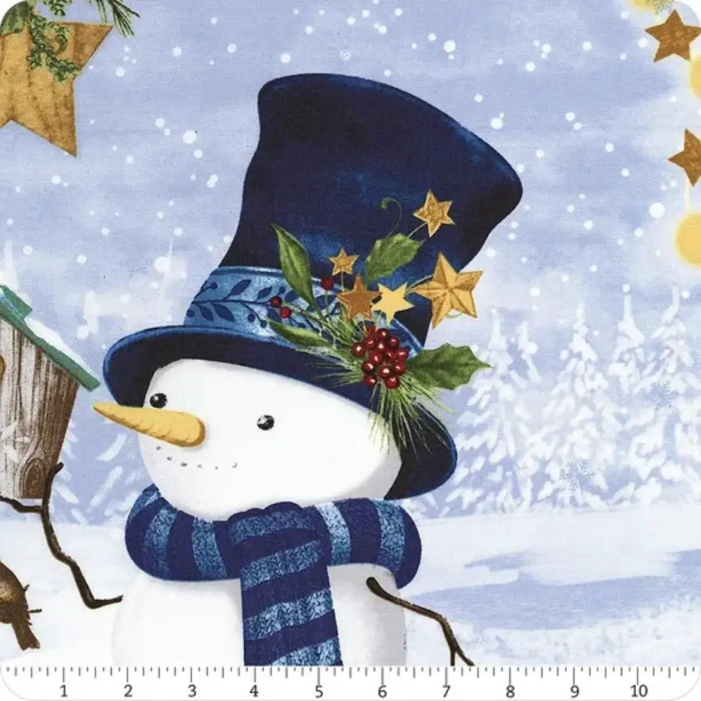 Let It Snow-Man! cotton quilt panel featuring three snowmen in blue winter clothing surrounded by snowy trees and festive greenery.