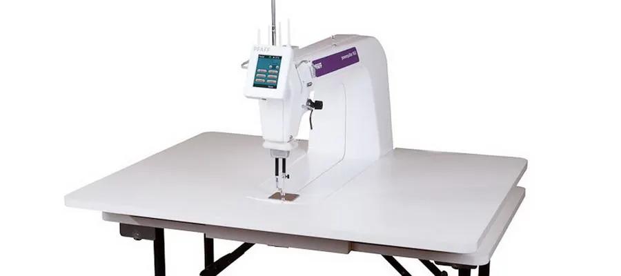 Pfaff PowerQuilter 16.0 long-arm quilting machine on a white table