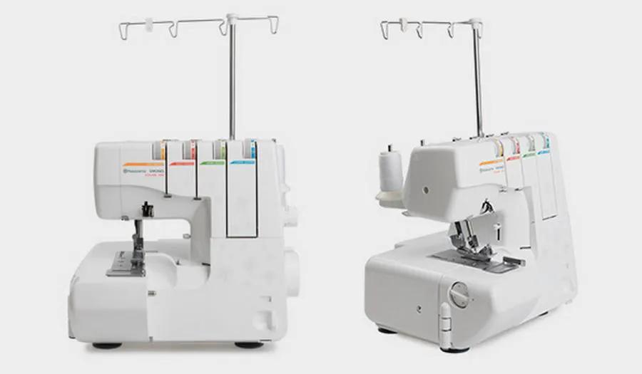 Husqvarna Viking Amber S100 serger machines, two white units with color-coded thread spools.
