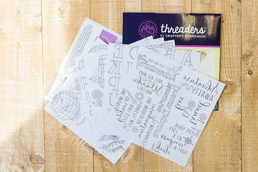 Threaders Embroidery Transfer Sheets Traveller; several white design sheets with printed motifs and Threaders packaging.
