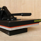 Ricoma high-pressure heat press with black body and yellow caution label