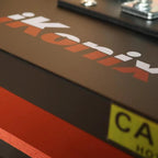 Ricoma Multifunction Heat Press HP-0401MF; dark gray unit with white Ricoma logo and red accent stripe.