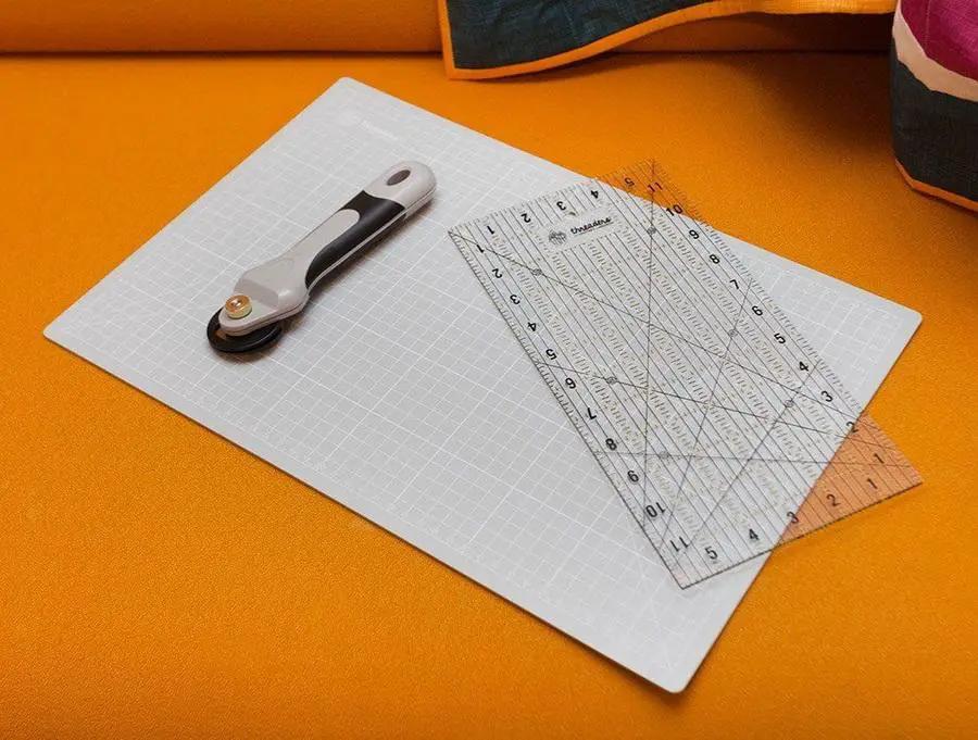 Crafters Companion Threaders Quilting Starter Kit (3 pc) with white rotary cutter, cutting mat, and clear rulers