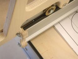 Close-up of a window latch mechanism on a window frame.