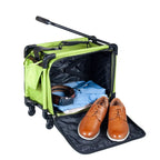 Tutto 17-inch small carry-on luggage on wheels in lime green, opened with clothes and brown shoes
