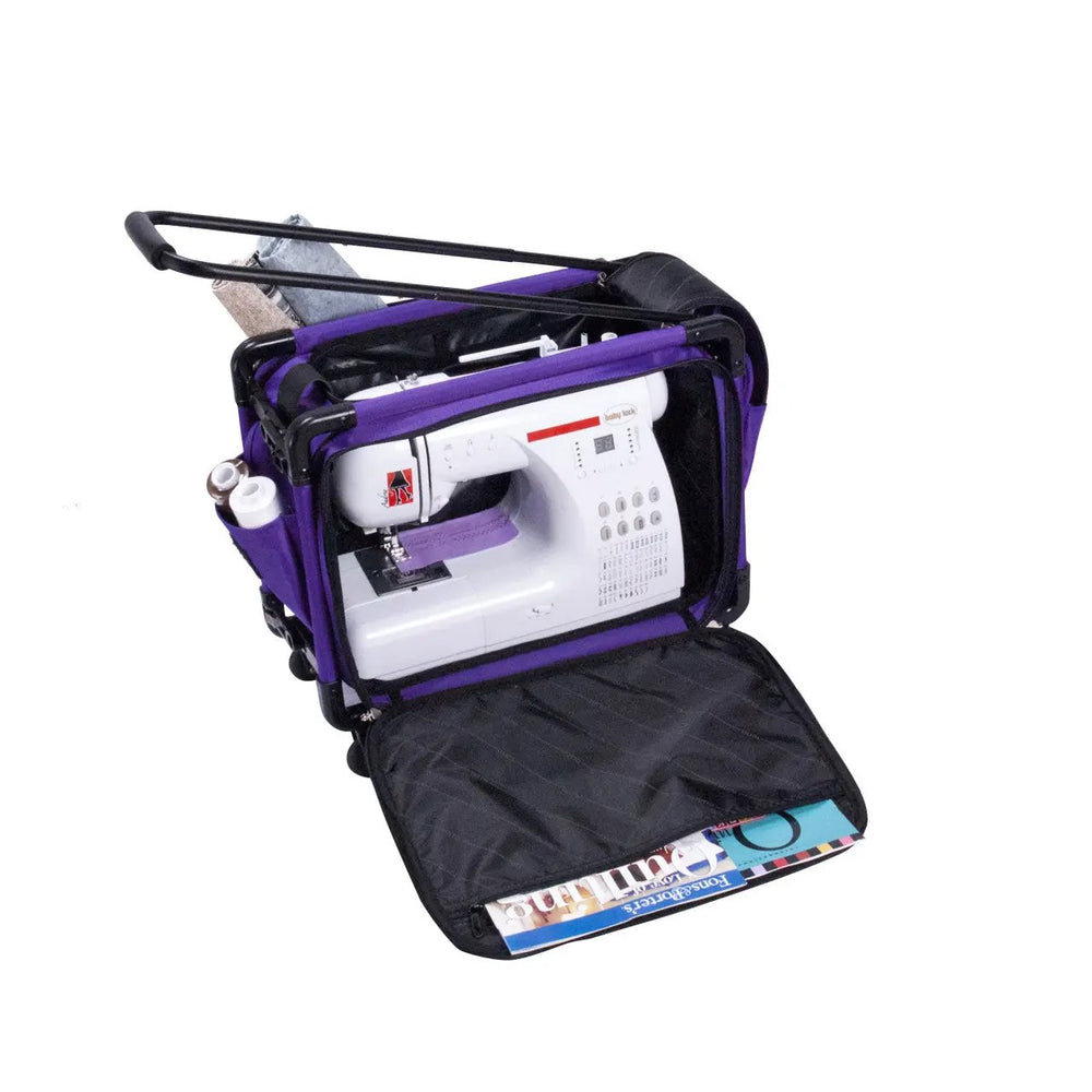 Tutto 17in small purple carry-on luggage on wheels, opened to reveal a sewing machine, accessories, and magazines in the pocket.