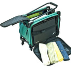 Tutto 17-inch turquoise carry-on luggage on wheels with laptop sleeve and rolled towels.